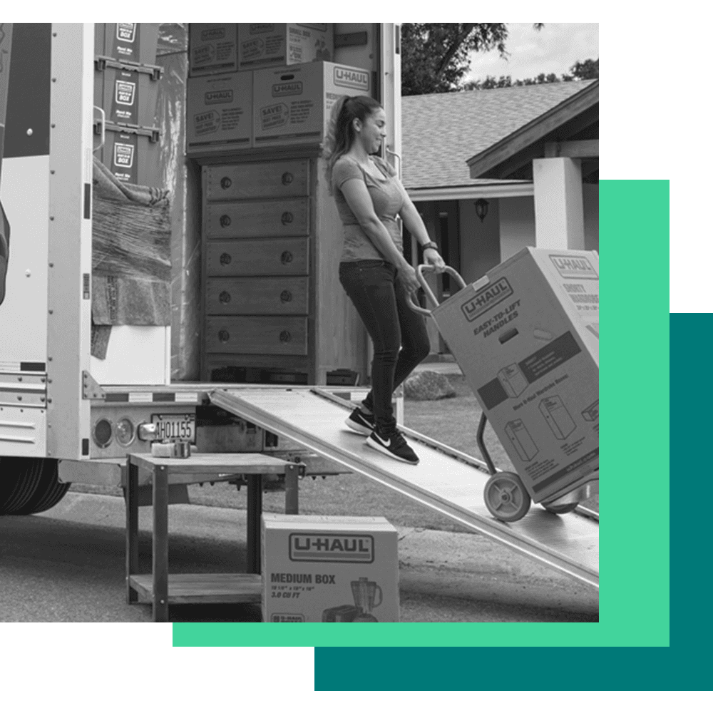 U-haul graphic of a woman unloading a moving truck with a box.